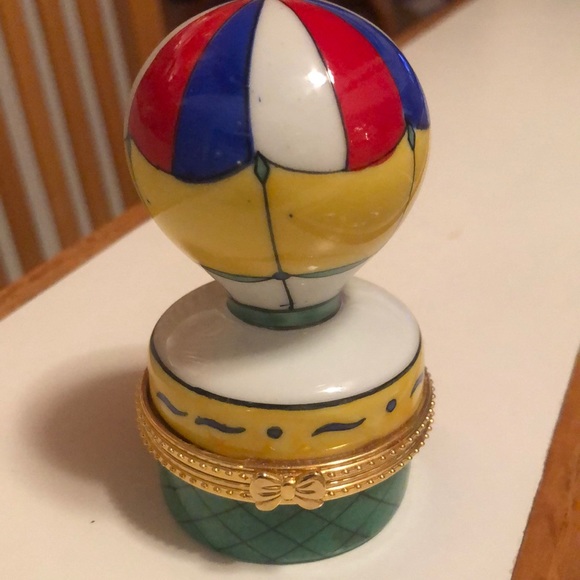 Hot air balloon trinket box colors are red white blue, yellow, green gold trim. - Picture 1 of 3